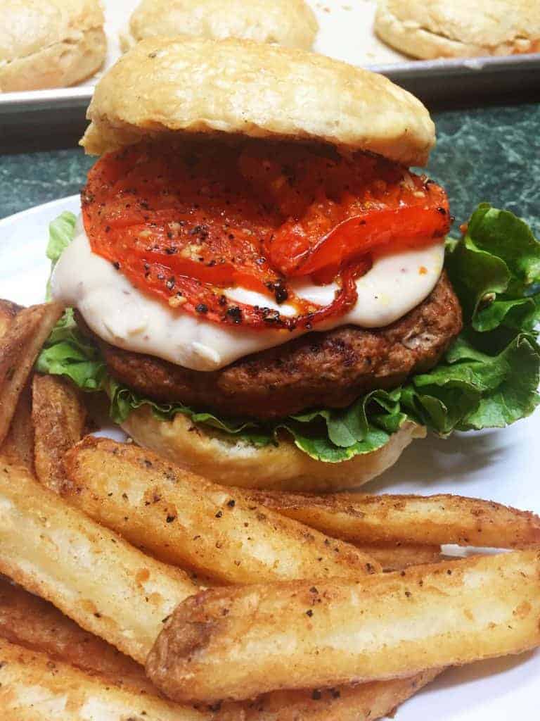 Chorizo Burger with Smoked Gouda Mornay Sauce & Roasted Tomatoes -- This decadent burger is sure to please everyone at the dinner table. -- lilsweetspiceadvice.com