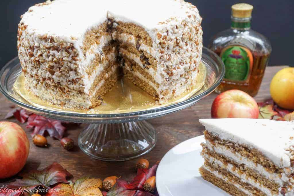 Crown Royal Apple Pecan Cake is the new Carrot Cake! Grated Honeycrisp apples, Crown Royal Apple, and chopped pecans are melded into a spiced cake batter and then frosted with chai spiced buttercream.