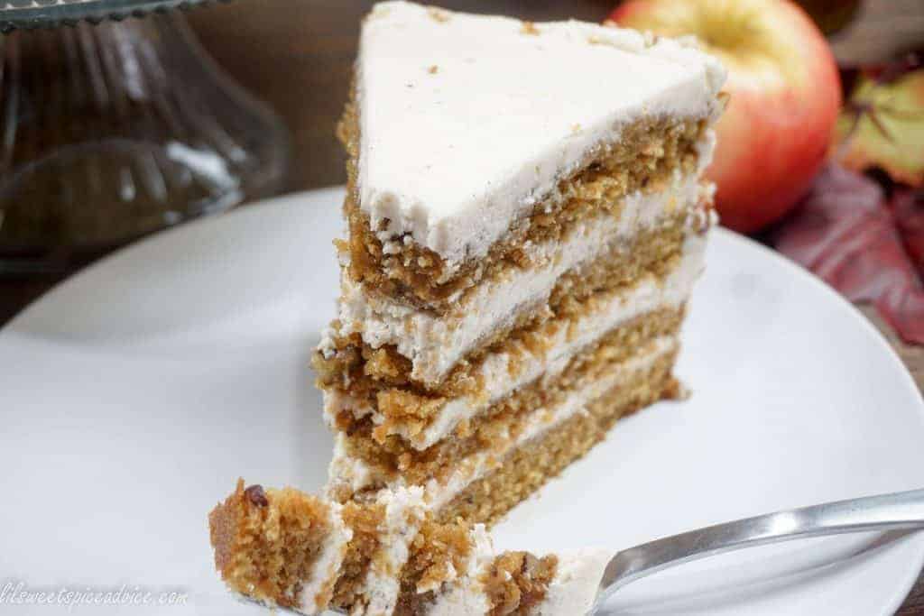 Crown Royal Apple Pecan Cake is the new Carrot Cake! Grated Honeycrisp apples, Crown Royal Apple, and chopped pecans are melded into a spiced cake batter and then frosted with chai spiced buttercream.