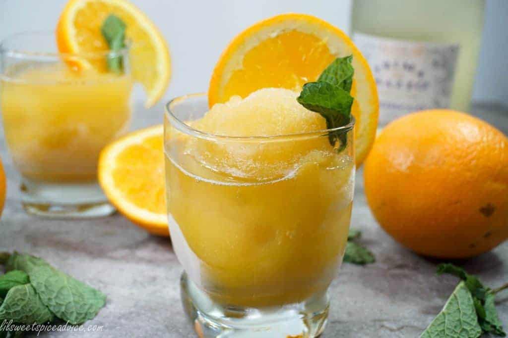 Orange Mint Julep Sorbet and Mimosas -- This sorbet & mimosa is sure to knock the socks off your guests this summer when they find out the bourbon is frozen IN the sorbet! -- lilsweetspiceadvice.com