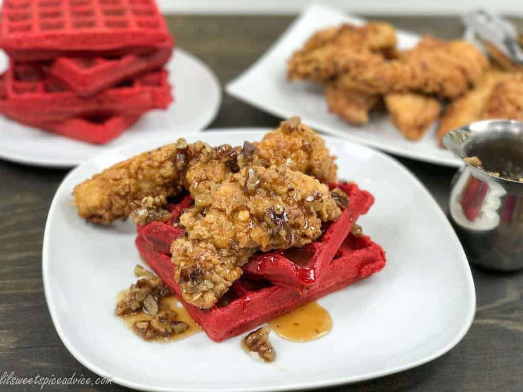 Spicy Buttermilk Fried Chicken and Red Velvet Waffles with Spicy Butter Pecan Syrup -- This is not your average chicken and waffles. The buttermilk fried chicken has a nice kick as well as the homemade butter pecan syrup which starts off sweet and then finishes with a kick. -- lilsweetspiceadvice.com