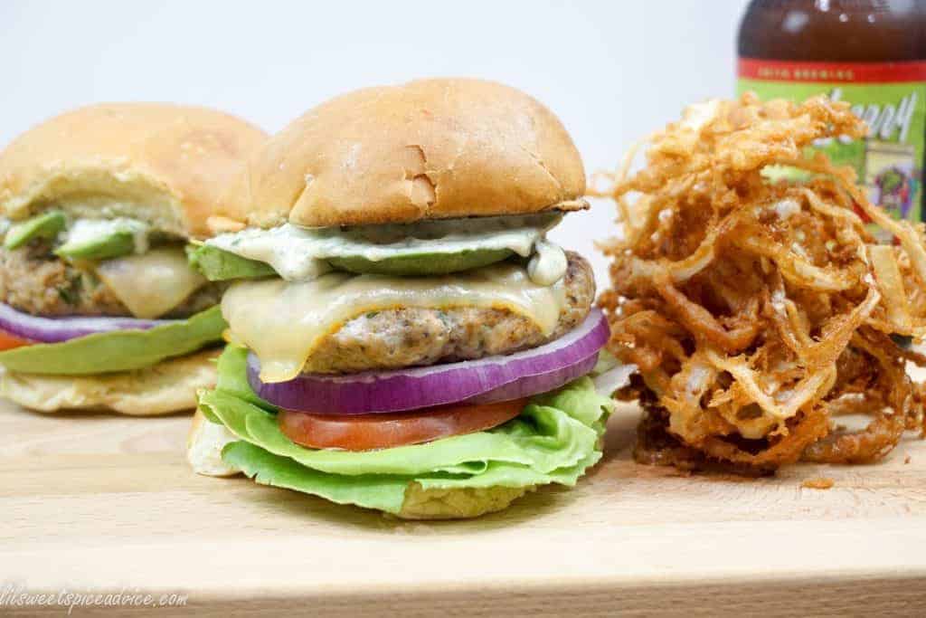 Poblano Lime Chicken Burgers with Roasted Garlic Mayo -- Poblano peppers give these juicy chicken burgers little bits of crunch while lime zest and lime juice lend a little zing. Roasted garlic mayo is the perfect addition to these chicken burgers. -- lilsweetspiceadvice.com