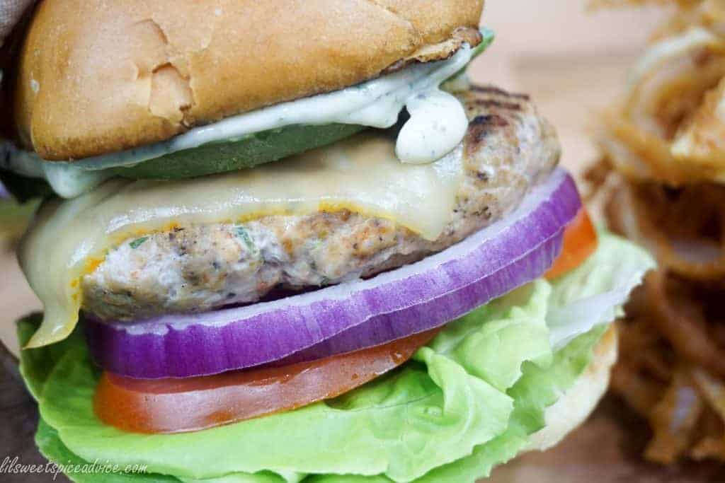 Poblano Lime Chicken Burgers with Roasted Garlic Mayo -- Poblano peppers give these juicy chicken burgers little bits of crunch while lime zest and lime juice lend a little zing. Roasted garlic mayo is the perfect addition to these chicken burgers. -- lilsweetspiceadvice.com