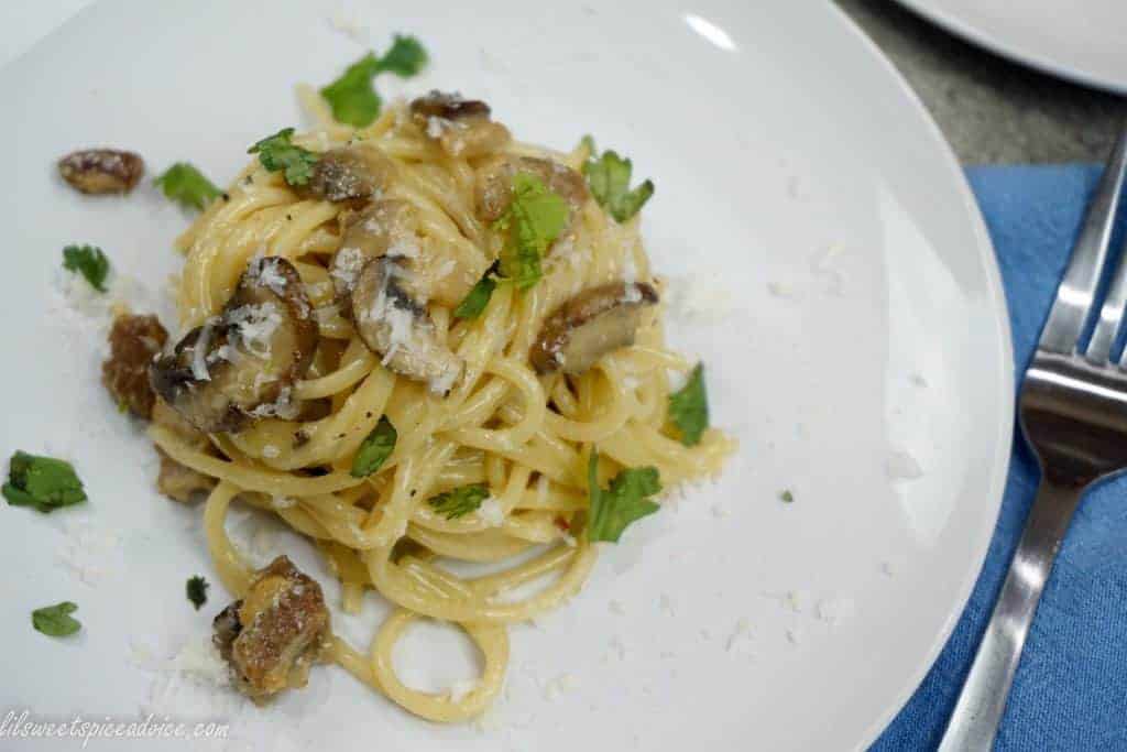 Roasted Garlic Mushroom Spaghetti Carbonara -- This is my twist on the classic spaghetti carbonara! Diced pork belly, sweet roasted garlic, sauteed mushrooms, and serrano pepper give this spaghetti carbonara an incredible punch of flavor. -- lilsweetspiceadvice.com