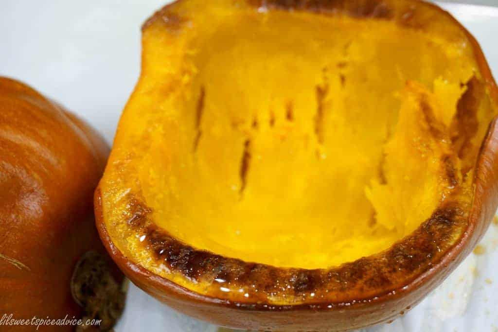 Roasted Pumpkin Soup -- Freshly roasted pie (sugar) pumpkin deserves some spotlight in a delightfully creamy soup topped with crispy bacon. -- lilsweetspiceadvice.com #roastedpumpkin #pumpkinsoup #creamysoup