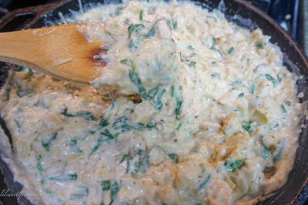 Shrimp Spinach Artichoke Dip-- This is the creamiest recipe for spinach artichoke dip you'll ever try thanks to the Mornay sauce used instead of cream cheese or sour cream. The addition of three cheese makes this dip irresistibly cheesy. -- lilsweetspiceadvice.com #shrimpspinachartichokedip #spinachartichokedip #mornaysauce