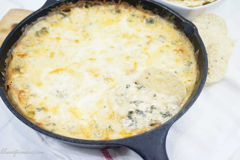Shrimp Spinach Artichoke Dip-- This is the creamiest recipe for spinach artichoke dip you'll ever try thanks to the Mornay sauce used instead of cream cheese or sour cream. The addition of three cheese makes this dip irresistibly cheesy. -- lilsweetspiceadvice.com #shrimpspinachartichokedip #spinachartichokedip #mornaysauce
