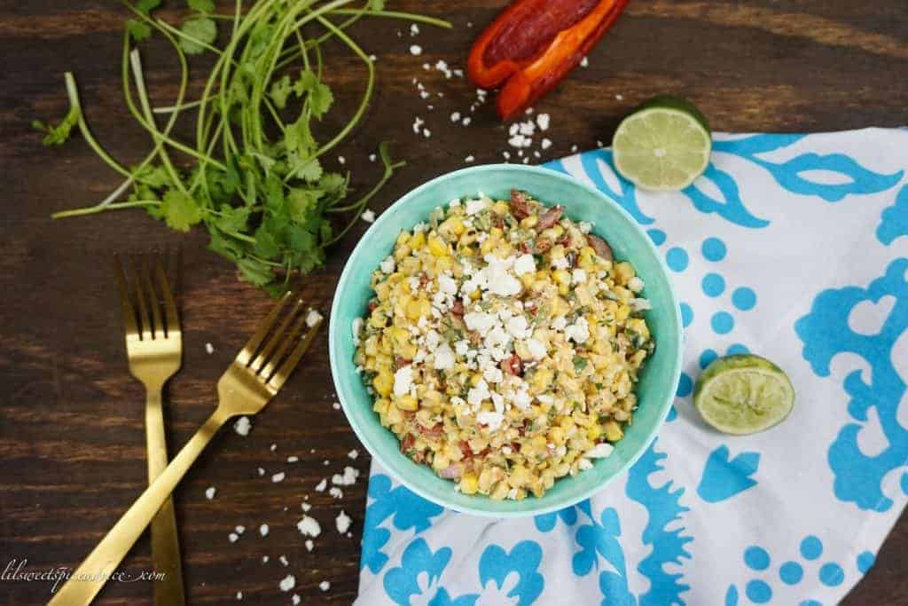 Mexican Street Corn Salad (Esquites) -- This Mexican Street Corn Salad is the perfect side dish for your BBQs and summer parties. It's creamy, a little spicy, and so smoky! -- lilsweetspiceadvice.com #mexicanstreetcorn #elotes #esquites #mexicanstreetcornsalad