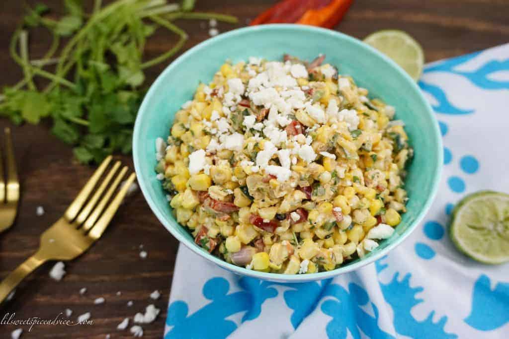 Mexican Street Corn Salad (Esquites) -- This Mexican Street Corn Salad is the perfect side dish for your BBQs and summer parties. It's creamy, a little spicy, and so smoky! -- lilsweetspiceadvice.com #mexicanstreetcorn #elotes #esquites #mexicanstreetcornsalad