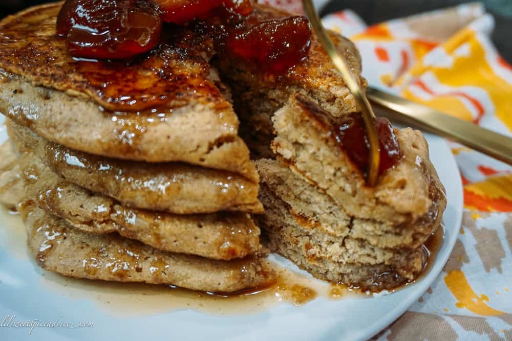 Cinnamon Vanilla Whole Wheat Pancakes with Homemade Plum Syrup -- The perfect fluffy and crispy whole wheat pancakes to satisfy all of your guests. Top the pancakes with the homemade plum syrup and you'll think you've transported to heaven! -- lilsweetspiceadvice.com #wholewheatpancakes #crispypancakes #homemadesyrup #cinnamonpancakes