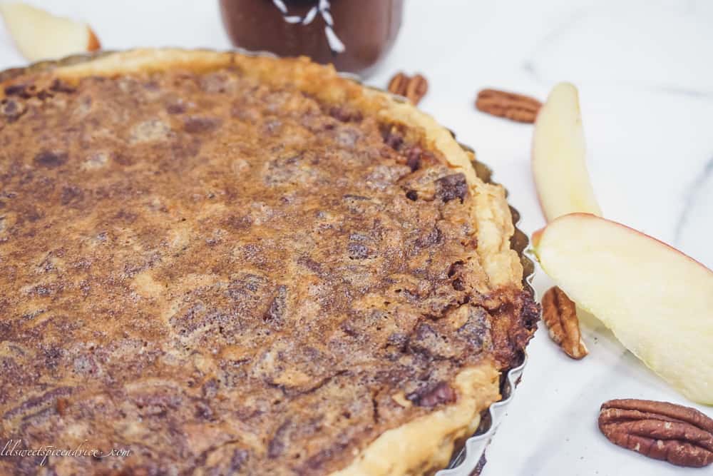 Apple Butter Pecan Pie with Puff Pastry Crust -- This pecan pie made without corn syrup gets a nice spiced addition from apple butter to make the greatest pecan pie ever! -- lilsweetspiceadvice.com #applebutterpecanpie #nocornsyruppecanpie #organicpecanpie #healthypecanpie #puffpastrypecanpie
