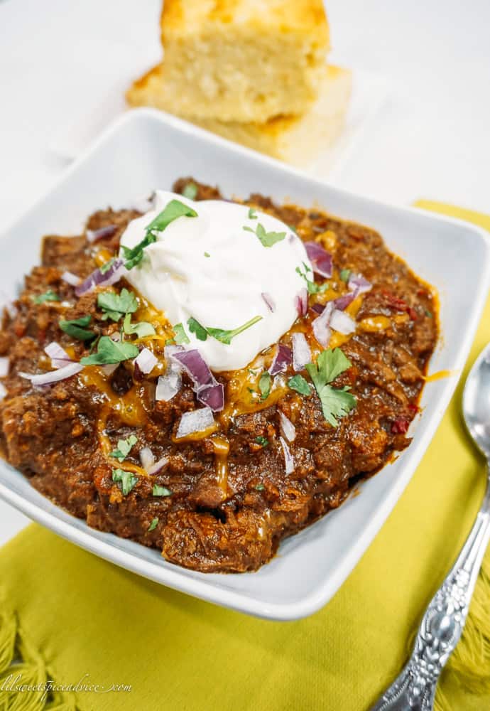 Instant Pot Texas Chili -- This bold and spicy Instant Pot Texas Chili is full of chunky cuts and ground chuck roast, spiced with a homemade chili paste, and is on your table in under two hours and tastes like it's cooked for hours! -- lilsweetspiceadvice.com #InstantPotTexasChili #TexasChili #chilinobeans #lilsweetspiceadvice