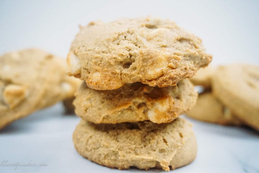 Gluten-Free Pumpkin White Chocolate Chip Cookies -- This recipe is the only pumpkin cookie recipe you'll need this fall! These pillowy soft cookies are perfectly spiced with warming homemade pumpkin pie spice, freshly roasted pumpkin, and real white chocolate chip cookies. -- lilsweetspiceadvice.com #glutenfreecookies #pumpkincookies #glutenfreepumpkindesserts